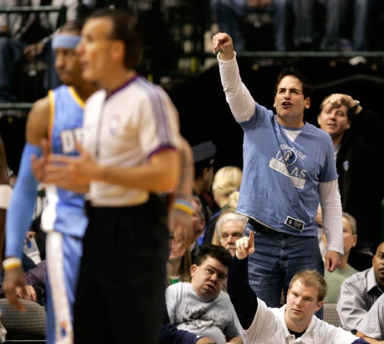Image: Mavericks owner Cuban shouts at the referee to count the basket after a Maverick was fouled in the first half of their NBA basketball game against the Nuggets in Dallas