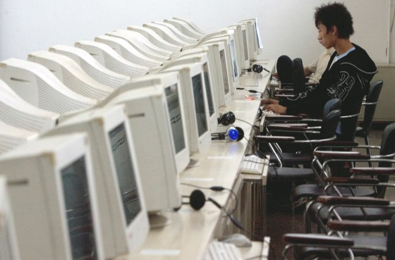 Image: A Chinese man uses the computer at an internet cafe in Beijing