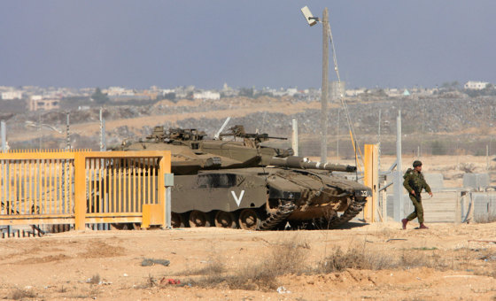 Image: An Israeli tank leaves Gaza through the Suffa Crossing border between Israel and Gaza Strip,.
