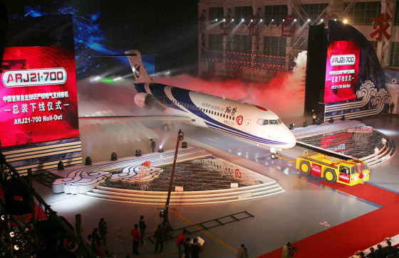 Image: China's first home-grown regional jet, the ARJ21-700, rolls off the production line in Shanghai.