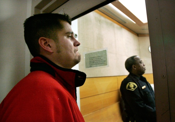 Image: Ben Anderson, grandson of a couple killed along with four other family members, watches during a hearing in a King County Jail courtroom