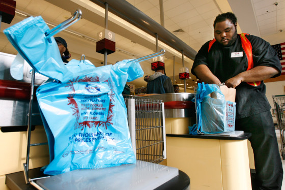 Image: Davon Johnson bags groceries at a Giant supermarket