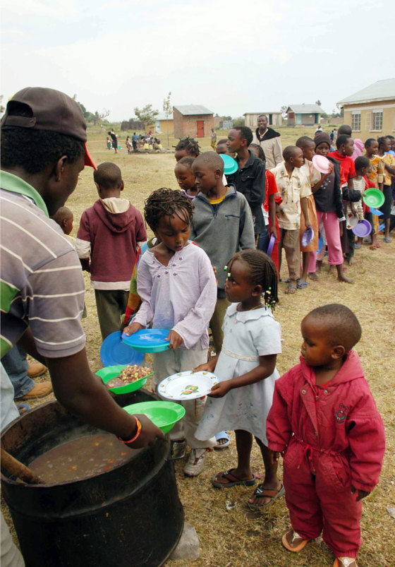 Image: Kenyan refugee children from the Kikuyu tribe stand in line to receive food