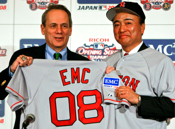 Image: Boston Red Sox Larry Lucchino and Toshio Morohoshi pose for the photographers
