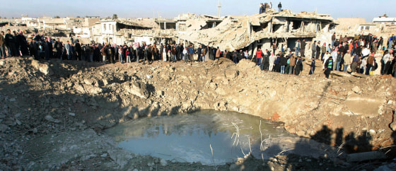Image: A huge crater at the site of Wednesday's bomb attack in Mosul