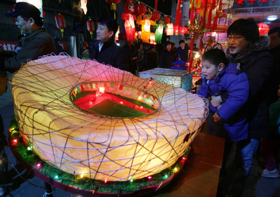 Image: A lantern in the shape of the Bird's Nest, the nickname for China's Olympic Stadium