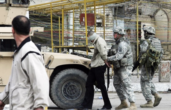 Image: American soldiers arrest a man suspected of being an al-Qaida member in Baghdad, Iraq