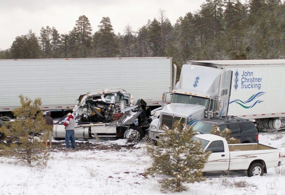 Image: Semi trucks and cars sit in a tangle on Interstate 40 near Flagstaff, Ariz.