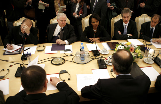 Image: U.S. Secretary of Defense Gates sits alongside U.S. Secretary of State Rice as they meet their Russian counterparts in Moscow