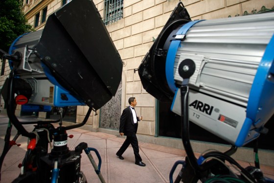 Image: An extra in the DreamWorks' production of \"The Soloist\" walks past movie lights