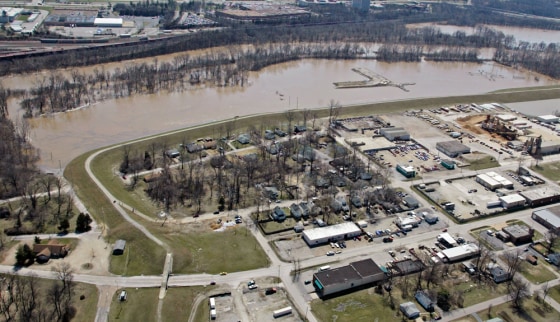 Image: A new levee holds back the floodwaters in Vally Park, Missouri.