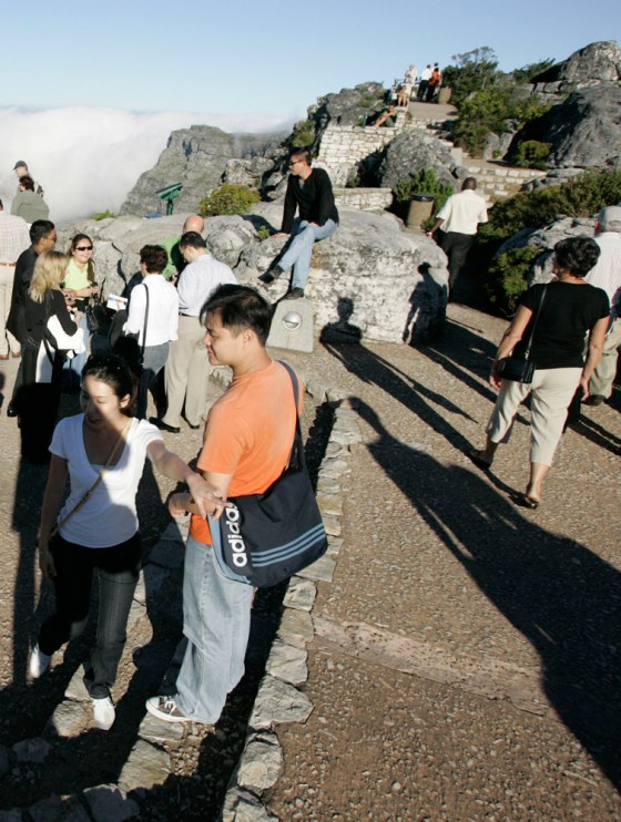 Image: Tourists stand around on top of Table Mountain Cape Town, South Africa