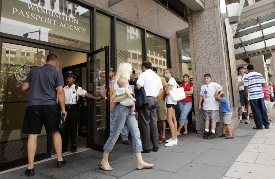 Image: People wait in line outside the U.S. Passport Office in Washington.