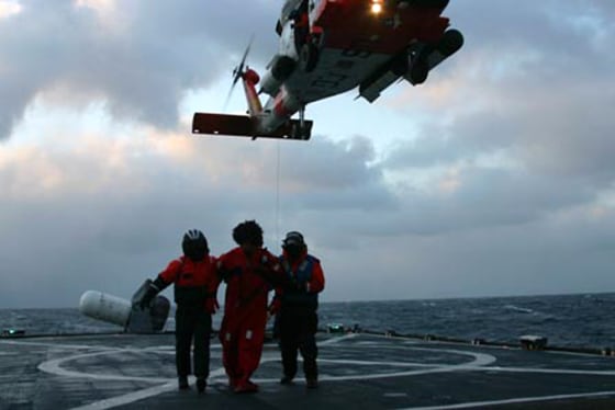 Image: A crew member of the Alaska Ranger taken on board the Coast Guard Cutter Munro