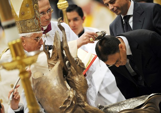 Image: Pope Benedict XVI baptises journalist Allam as he celebrates a Easter Vigil mass in Saint Peter's Basilica at the Vatican