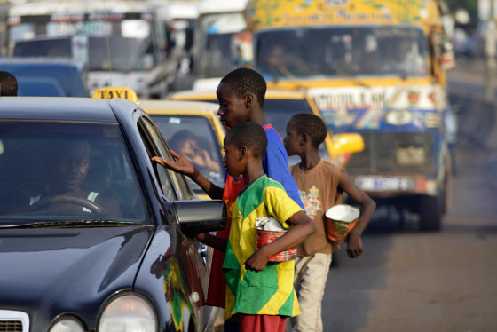 Religious students forced to beg for their Islam teacher ask for change and food in Dakar, Senegal.