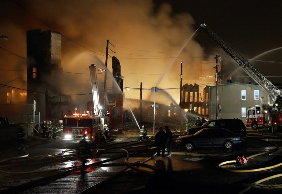 Image: Firefighters battle a seven alarm fire in a warehouse.