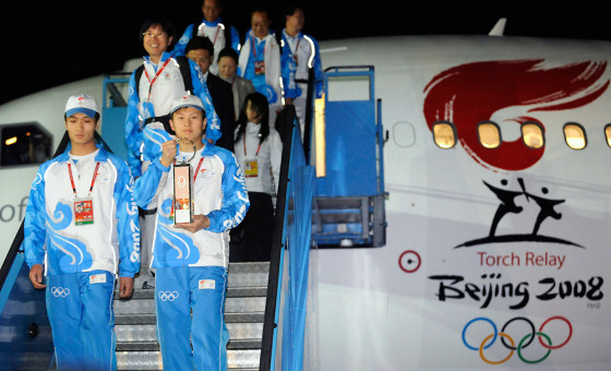 Image: The Olympic torch arrives in Pyongyang, North Korea