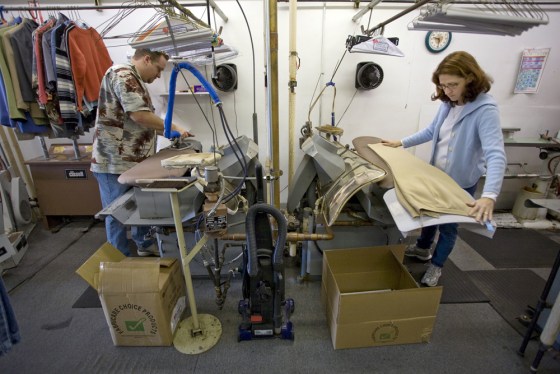 Image: Ryan and Samantha Vanausdall working at their Elkhorn Cleaners business