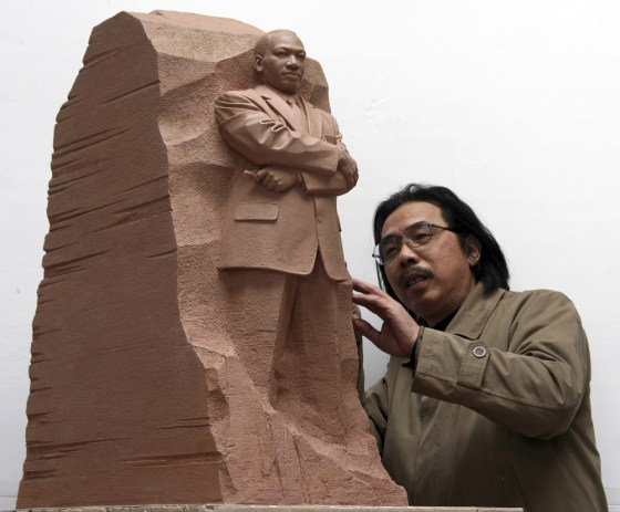 Sculptor Lei Yixin of China looks at a scale model of the "Stone of Hope," a piece he has created that will be the centerpiece of a new memorial for the Rev. Martin Luther King Jr. 