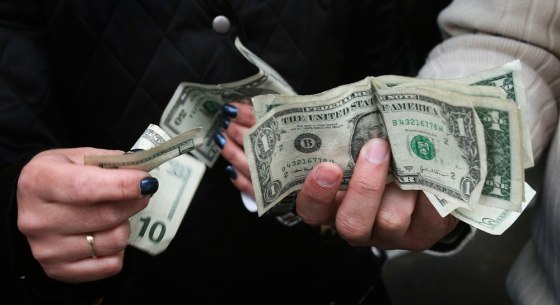 Image: two shoppers make change