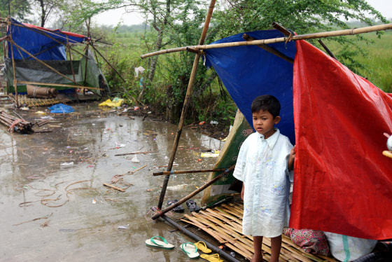 Image: A boy at a makeshift tent in Myanmar