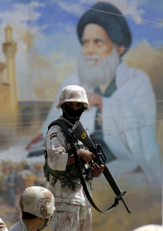 Image: An Iraqi soldier stands guard