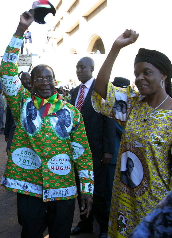 President Robert Mugabe, left, and his wife Grace greet party supporters Sunday&nbsp;at the launch&nbsp;of his runoff election campaign in Harare.&nbsp; 