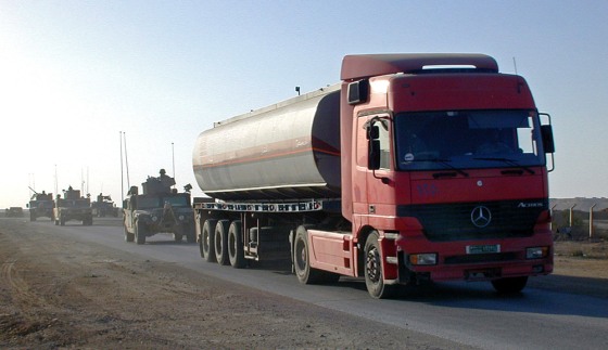 Image: Fuel tankers drive through the western Iraqi desert