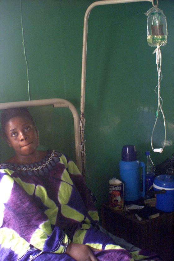 Malaria cases like this Nigerian woman are sometimes compouned by global warming, the World Health Organization said Thursday.