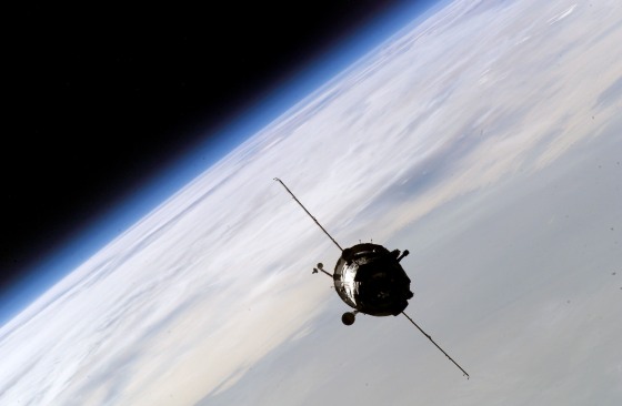 A Russian Soyuz crew capsule approaches the international space station for docking in October 2003. Russia is contractually bound to provide free Soyuz rides to NASA until the end of 2005.