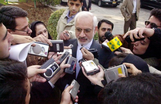 The head of Iran's Atomic Energy Organization, Vice President Gholamreza Aghazadeh, answers reporters' questions Wednesday after leaving a cabinet meeting in Tehran.