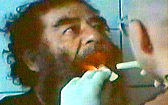 Captured former Iraqi leader Saddam Hussein shown Sunday, Dec. 14.