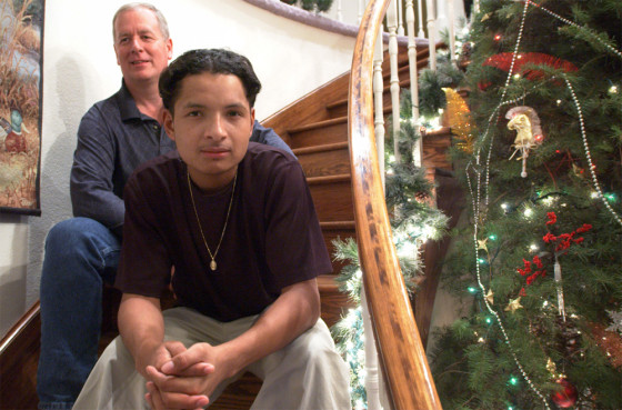 Spending this Christmas in the safety and comfort of a home in Washington state is a new experience for Dennis Cruz-Aguilar, 17, shown here with foster dad Larry Hewitt.
