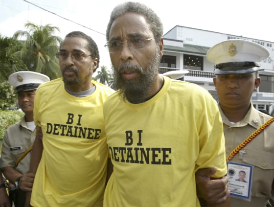 PHILIPPINE MARINE SOLDIERS ESCORT ARRESTED AMERICANS AT NAVY HEADQUARTERS IN MANILA