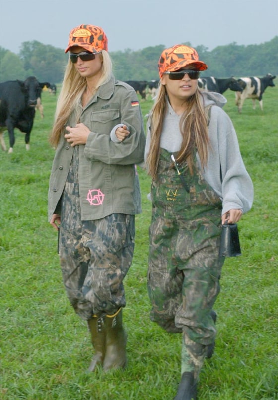 Paris Hilton (left) and Nicole Richie work on a dairy farm in Fox's "The Simple Life." The success of reality TV shows has prompted the major networks to stick with simple program ideas.