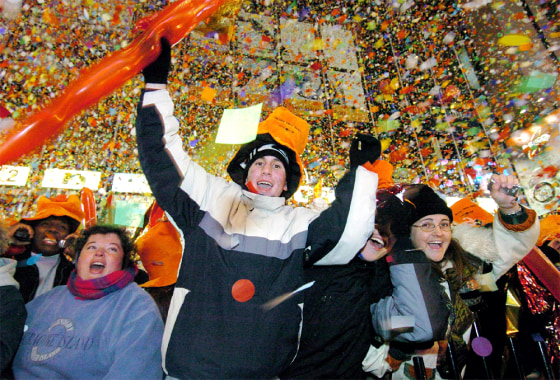 CELEBRANTS IN CONFETTI STORM IN TIMES SQUARE