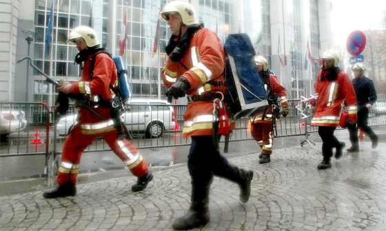 BELGIAN FIREFIGHTERS WALK PAST EUROPEAN PARLIAMENT IN BRUSSELS, AFTER A LETTER BOMB EXPLODED