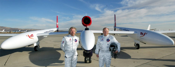 BRANSON AND FOSSETT STAND WITH RECORD ATTEMPTING PLANE AT UNVEILING IN U.S. DESERT