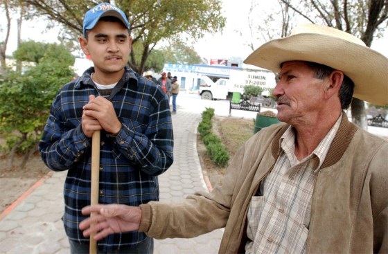 Alejandro Chapa, left, and Ismael Gonzalez Cantu in the town of General Bravo, Mexico, express doubt over Bush's immigration plan.