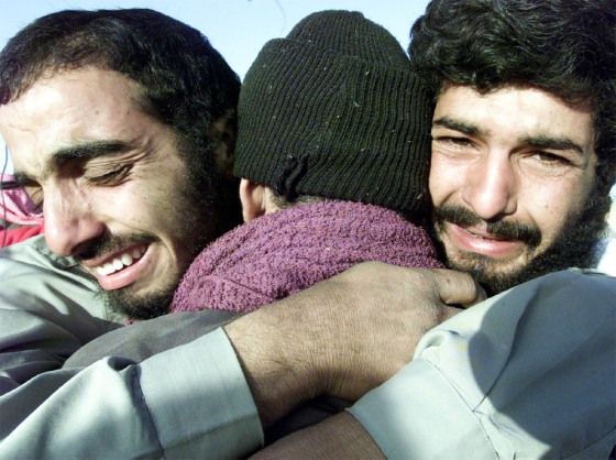 IRAQI PRISONERS EMBRACE ON RELEASE FROM U.S. CUSTODY IN ABU GHRAIB