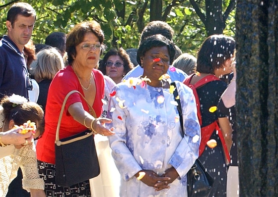 A woman throws petals of flowers onto the Memorial for the Victims of Terrorism, during a ceremony at the Hotel des Invalides, in Paris last September.