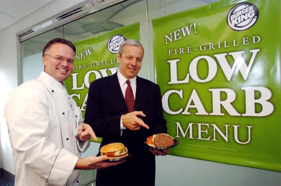 David "Guilley" Guilfoyle, left, manager of product development for Burger King Corporation holds the original Burger King Whopper, while Brad Blum, CEO of Burger King, touts the new Low-Carb Whopper.