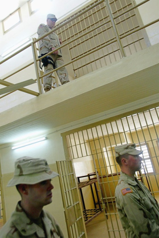 U.S. soldiers walked past prison cells at the Abu Ghraib prison just outside Baghdad in September.