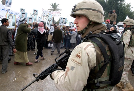 U.S. ARMY TROOPS WATCH PROTEST BY IRAQI GROUP AGAINST PLANNED FEDERAL SYSTEM
