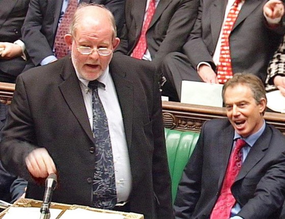 British Education Secretary Charles Clarke, left, opens the debate in the House of Commons with Prime Minister Tony Blair sitting at his side in London on Tuesday.