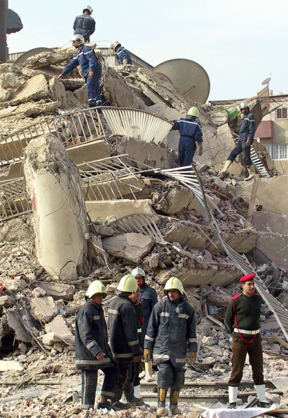 RESCUE WORKERS LOOK FOR SURVIVORS UNDER THE RUBBLE OF A COLLAPSED BUILDING IN CAIRO