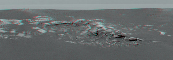 A stereo image taken by Opportunity's panoramic camera shows a layered outcropping of Martian bedrock just a few yards away. Viewing the image with red-blue glasses produces a 3-D effect.