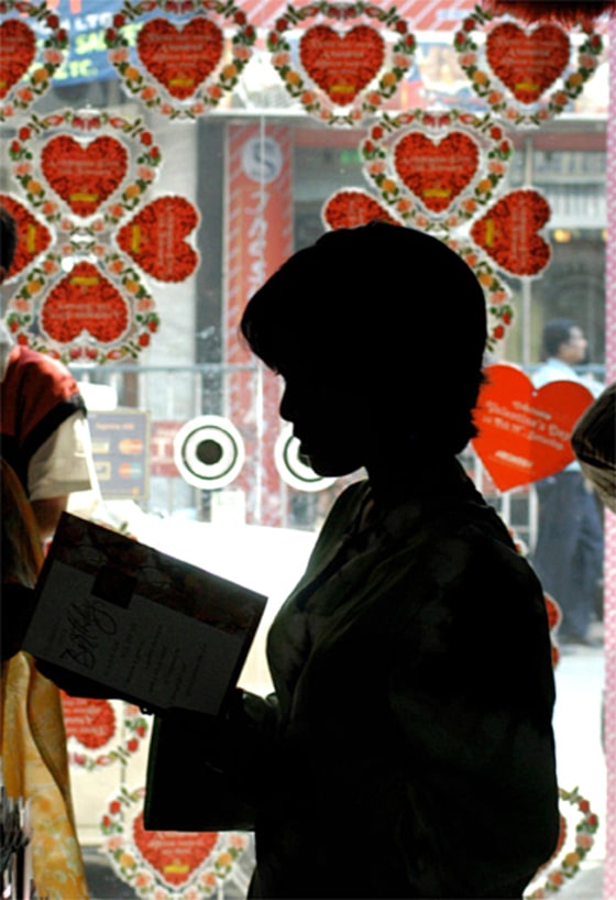 An Indian youth browses through Valentine's Day cards in a shop in Calcutta on Tuesday, despite Hindu nationalists' threats against those who celebrate the Western holiday.