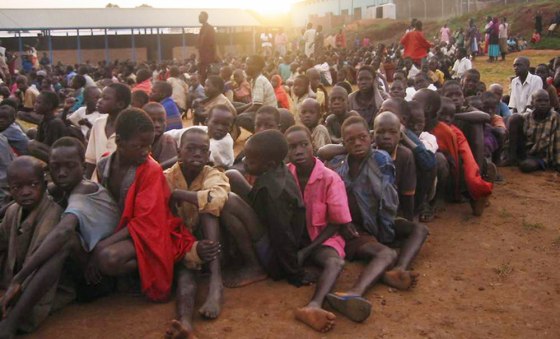 Children in Noah's Ark shelter prepare to return to their villages after having spent the night there. They leave the shelter during the early morning hours.